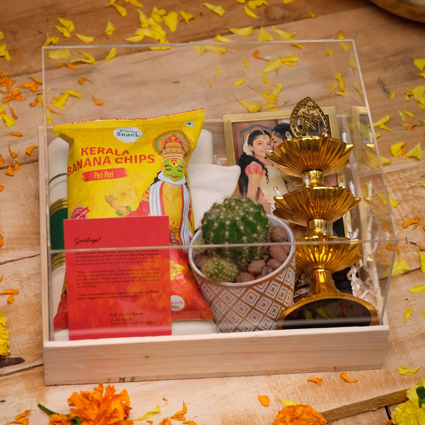 Chithira Onam Gift Hamper with Silver Coin, Set Saree/Dhoti, Succulent, Lamp and Décor | Packaged in Premium Pine Wood Tray | Elegant Presentation
