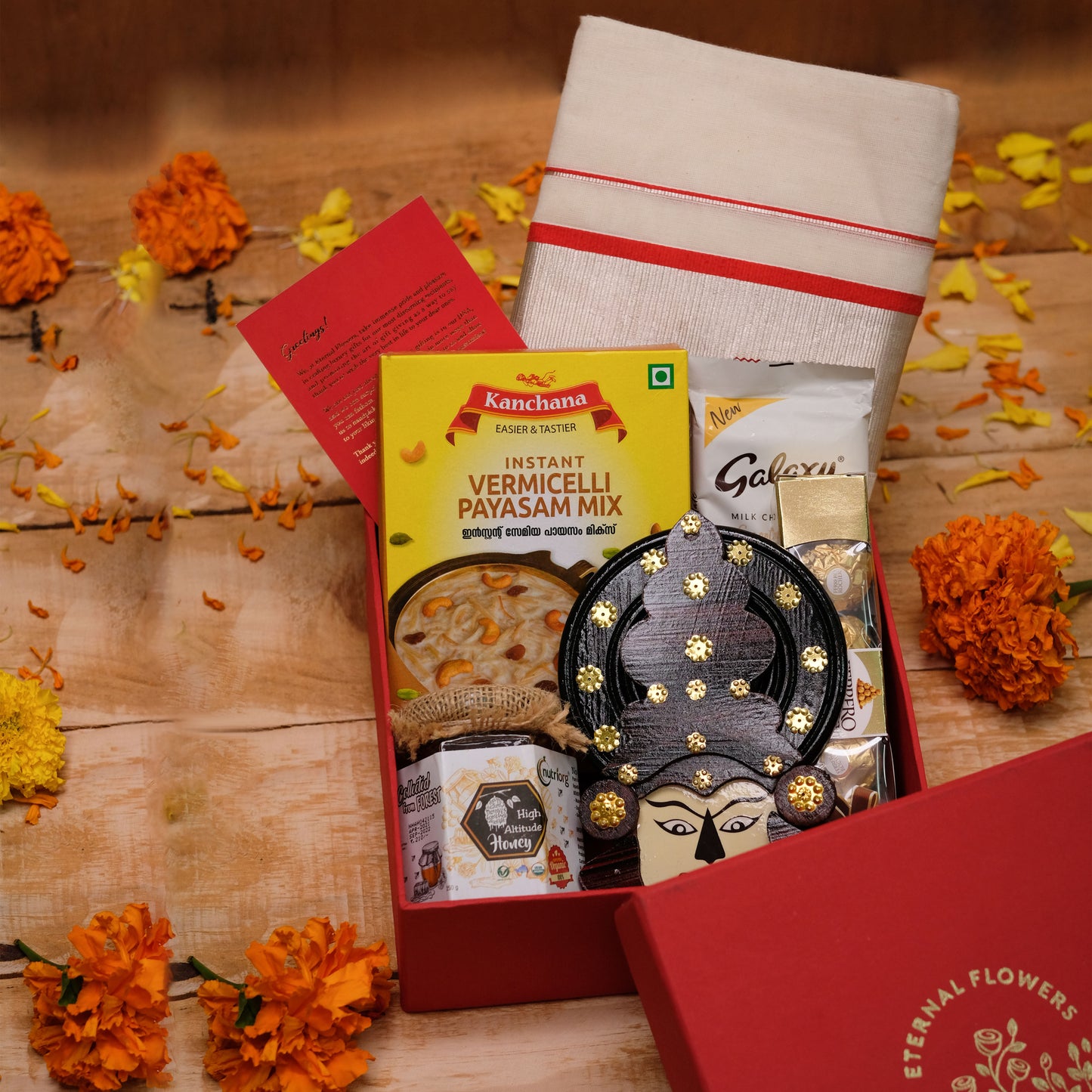 Mudra Onam Gift Hamper with Set Saree, Chocolates, Payasam Mix & Kathakali Décor | Packaged in Premium Rigid Box | Elegant Presentation
