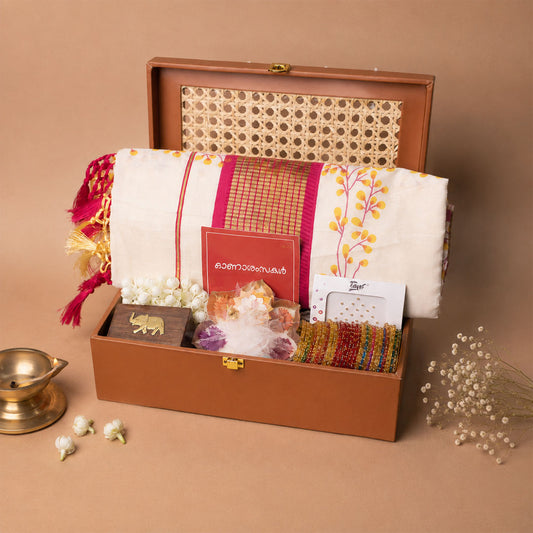 Onakodi For Her Premium Onam Gift Hamper with Saree, Jewellery Box, Bangles and Lotus Uruli Candle