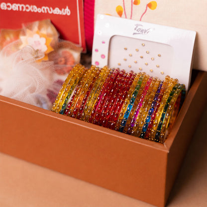 Onakodi For Her Premium Onam Gift Hamper with Saree, Jewellery Box, Bangles and Lotus Uruli Candle