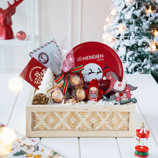 Winter Wonderland Delight Christmas Gift Hamper with Plum Cake, Candle, Chocolates, and Ornaments